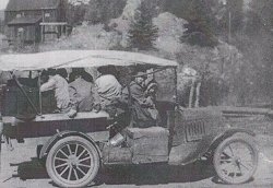 Stanley Steamer with tourists on the way to Estes Park