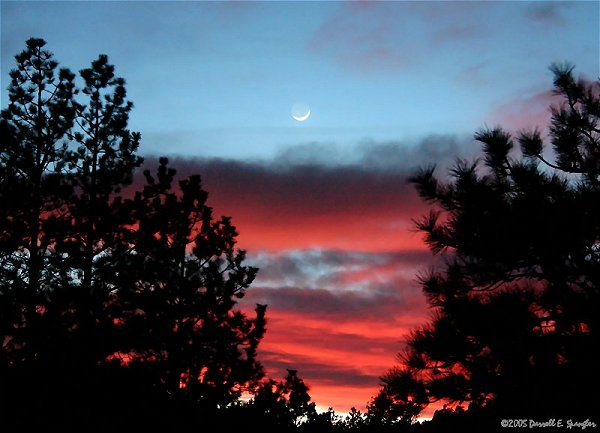 Moon and Earthshine against spectacular Colorado sunset