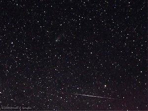 Meteor streaking past Fragment "C" of 73P/S-W3 on May 9th, 2006