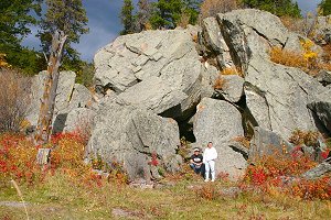 Bridget and Darrell by rock outcrop in Galuchie Meadows